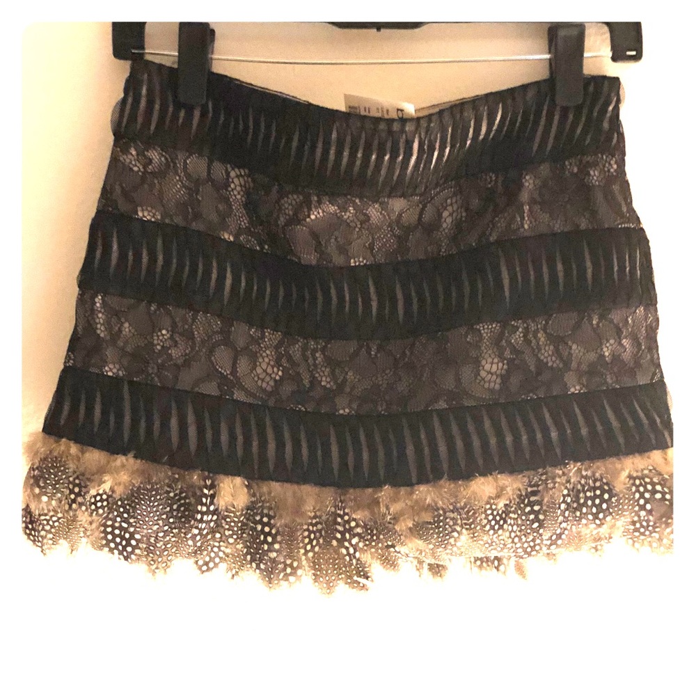 Bebe feathered/laced skirt. NEW WITH TAGS